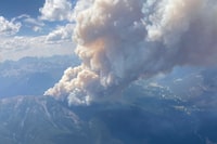 A wildfire in southeastern British Columbia, shown in a handout photo from the BC Wildfire Service, first spotted on Monday afternoon, has charred three square kilometres in less than 24 hours and is threatening more than 1,000 properties, including a ski resort, west of Invermere. THE CANADIAN PRESS/HO-BC Wildfire Service **MANDATORY CREDIT**