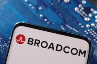 FILE PHOTO: A smartphone with a displayed Broadcom logo is placed on a computer motherboard in this illustration taken March 6, 2023. REUTERS/Dado Ruvic/Illustration/File Photo