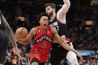 Toronto Raptors forward Scottie Barnes (4) drives for the basket as Portland Trail Blazers centre Jusuf Nurkic (27) defends during second half NBA basketball action in Toronto on Sunday, Jan. 8, 2023. THE CANADIAN PRESS/Frank Gunn
