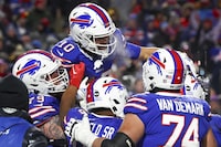 Buffalo Bills wide receiver Khalil Shakir (10) celebrates with teammates after scoring a touchdown against the Pittsburgh Steelers during the fourth quarter of an NFL wild-card playoff football game, Monday, Jan. 15, 2024, in Buffalo, N.Y. (AP Photo/Jeffrey T. Barnes)