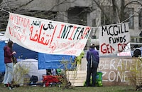 Pro-Palestinian students and activists protest at an encampment on the campus at McGill University in Montreal, Canada, on April 29, 2024. About a hundred people have set up an encampment on McGill campus on April 27, 2024 demanding the university divest from Israel-connected funds. (Photo by Graham Hughes / AFP) (Photo by GRAHAM HUGHES/AFP via Getty Images)