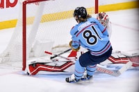 Carolina Hurricanes goaltender Antti Raanta (32) makes a save on Winnipeg Jets' Kyle Connor (81) during third period NHL action in Winnipeg on Monday December 4, 2023. THE CANADIAN PRESS/Fred Greenslade