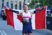 Malindi Elmore finishes the 2022 Toronto Waterfront Marathon as the top Canadian female runner, in Toronto, on Sunday, Oct. 16, 2022. Elmore and Cam Levins are heading to Paris this summer. Athletics Canada announced the two marathon runners earned early nominations to represent Canada at the 2024 Paris Olympics. THE CANADIAN PRESS/Alex Lupul
