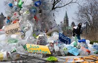 A person walks past a public art installation outside a United Nations conference on plastics on Tuesday, April 23, 2024 in Ottawa.  THE CANADIAN PRESS/Adrian Wyld