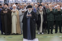 In this photo released by an official website of the office of the Iranian supreme leader, Supreme Leader Ayatollah Ali Khamenei leads Eid al-Fitr prayer marking the end of the Muslims holy fasting month of Ramadan, in Tehran, Iran, Wednesday, April 10, 2024. Ayatollah Khamenei reiterated on Wednesday a promise to retaliate against Israel over the killings of Iranian generals in Syria. (Office of the Iranian Supreme Leader via AP)
