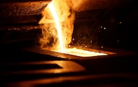 Liquid gold is poured to form gold ore bars at Newmont Corp's Carlin gold mine operation near Elko, Nevada May 21, 2014.
