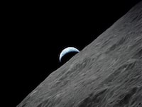 FILE PHOTO: The crescent Earth rises above the lunar horizon in this undated NASA handout photograph taken from the Apollo 17 spacecraft in lunar orbit during the final lunar landing mission in the Apollo program in 1972. REUTERS/NASA/Handout    (UNITED STATES - Tags: SCIENCE TECHNOLOGY) FOR EDITORIAL USE ONLY. NOT FOR SALE FOR MARKETING OR ADVERTISING CAMPAIGNS/File Photo