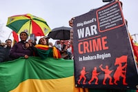 WASHINGTON, DC - DECEMBER 17: Members of the Ethiopian community take part in a protest calling for the cessation of drone strikes on civilian populations in the Amhara region of Ethiopia during a protest at the White House on December 17, 2023 in Washington, DC.  The current regime in Ethiopia under Prime Minister Abiy Ahmed has been accused of killing over 800 civilians and injuring 634 as it conducted over 100 drone strikes since August 3, 2023 in the Amhara region targeting civilian and non-military targets under the guise of striking FANO militia.  The regime of Abiy Ahmed has been engaged in a war with the FANO militia since April of 2023 after it attempted to disarm the group without promising the Amhara region protection from the Tigray Peoples Liberation Front and elements of the Oromo extremist movement.  The Amhara ethnic group has been facing mass murder and ethnic cleansing at the hands of both groups overtly and secretly over the past 30 years.  (Photo by J. Countess/Getty Images)