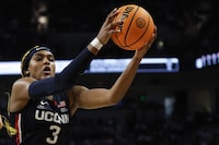 UConn forward Aaliyah Edwards pulls in a rebound during the second half of an NCAA college basketball game against South Carolina in Columbia, S.C., Sunday, Feb. 11, 2024. (AP Photo/Nell Redmond)