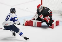 Canada goaltender Ann-Renee Desbiens (35) makes a save against Finland's Petra Nieminen (16) during first period hockey action at the IIHF Women's World Hockey Championship in Utica, N.Y., Thursday, April 4, 2024. THE CANADIAN PRESS/Christinne Muschi