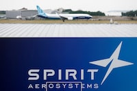 FILE PHOTO: A Boeing 737 MAX-10 lands over the Spirit AeroSystems logo during a flying display at the 54th International Paris Air Show at Le Bourget Airport near Paris, France, June 22, 2023. REUTERS/Benoit Tessier/File Photo