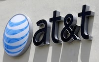 FILE - This July 27, 2017, file photo shows an AT&T logo at a store in Hialeah, Fla. On Monday, Feb. 26, 2018, the 9th U.S. Circuit Court of Appeals said the Federal Trade Commission can indeed punish telecommunications companies for deceptive practices. The FTC still must prove that AT&T was deceptive. The case is over claims that AT&T misled smartphone customers in offering unlimited data plans, but slowing speeds for heavy users. (AP Photo/Alan Diaz, File)
