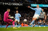 Manchester City's Erling Haaland, right, attempts a goal during the FA Cup quarterfinal soccer match between Manchester City and Newcastle at the Etihad Stadium in Manchester, England on March 16.