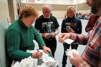 Votes are counted during a caucus to choose a Republican presidential candidate, at Fellows Elementary School, in Ames, Iowa, U.S. January 15, 2024. REUTERS/Cheney Orr
