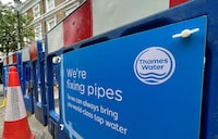 FILE PHOTO: Signage is seen for British utility company Thames Water at a repair site in London, Britain, June 28, 2023. REUTERS/Toby Melville/