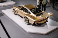 A US$2.7-million metallic-gold machine called the Porsche 911 reimagined by Singer, Dynamics and Lightweighting Study (DLS) Turbo.