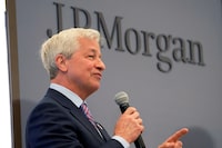 FILE PHOTO: JP Morgan CEO Jamie Dimon delivers a speech during the inauguration the new French headquarters of JP Morgan bank in Paris, France June 29, 2021.  Michel Euler/Pool via REUTERS/File Photo