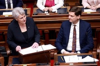 Finance Minister Katrine Conroy tables the budget as Premier David Eby looks on from the legislative assembly at the legislature in Victoria, Thursday, Feb. 22, 2024. THE CANADIAN PRESS/Chad Hipolito