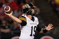 Hamilton Tiger-Cats quarterback Bo Levi Mitchell attempts a pass during first half CFL action against the Ottawa Redblacks, Friday, July 28, 2023 in Ottawa.  THE CANADIAN PRESS/Adrian Wyld