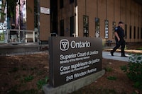 A police officer is seen outside Superior Court in Windsor, Ont., on day one of the trial of a man facing terror-related murder charges in the 2021 deaths of four members of a Muslim family, on Tuesday, Sept.5, 2023. THE CANADIAN PRESS/Dax Melmer