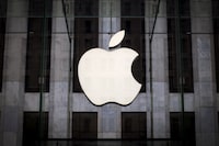 FILE PHOTO: An Apple logo hangs above the entrance to the Apple store on 5th Avenue in the Manhattan borough of New York City, July 21, 2015.  REUTERS/Mike Segar/File Photo