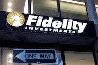 FILE - In this Oct. 14, 2019 file photo a Fidelity Investments logo is attached to a building, in Boston. Fidelity is launching a new type of account for teenagers to save, spend and invest their money. The account is for 13- to 17-year-olds, and it will allow them to deposit cash, have a debit card and trade stocks and funds. (AP Photo/Steven Senne, File)