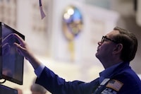 A trader works on the trading floor at the New York Stock Exchange (NYSE) in New York City, U.S., April 5.