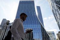 People walk past the new headquarters of the European Bank for Reconstruction and Development (EBRD) in Canary Wharf, London on Sept. 14.