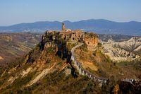 General view of Civita di Bagnoregio, accessible only by a bridge and known as 'the dying town' due its susceptibility to erosion and landslides, Italy, March 24, 2021. Picture taken March 24, 2021. REUTERS/Guglielmo Mangiapane
