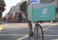 FILE PHOTO: A cyclist delivers food for Deliveroo in London, Britain, September 15, 2016.  REUTERS/Toby Melville/File Photo
