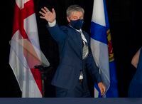 Nova Scotia Progressive Conservative leader Tim Houston waves to supporters after winning a majority government in the provincial election at the Pictou County Wellness Centre in New Glasgow, N.S. on Tuesday, Aug. 17, 2021. THE CANADIAN PRESS/Andrew Vaughan