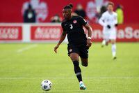 HAMILTON, ON - JANUARY 30:  Sam Adekugbe #3 of Canada dribbles the ball during a 2022 World Cup Qualifying match against the United States at Tim Hortons Field on January 30, 2022 in Hamilton, Ontario, Canada.  (Photo by Vaughn Ridley/Getty Images)
