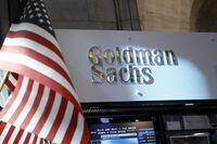 FILE PHOTO: A view of the Goldman Sachs stall on the floor of the New York Stock Exchange July 16, 2013. REUTERS/Brendan McDermid (UNITED STATES - Tags: BUSINESS)/File Photo