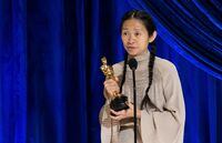 Chloe Zhao accepts the Oscar for Directing during the live ABC Telecast of The 93rd Oscars in Los Angeles, California, U.S., April 25, 2021. Todd Wawrychuk/A.M.P.A.S./Handout via REUTERS ATTENTION EDITORS. THIS IMAGE HAS BEEN SUPPLIED BY A THIRD PARTY. NO MARKETING OR ADVERTISING IS PERMITTED WITHOUT THE PRIOR CONSENT OF A.M.P.A.S AND MUST BE DISTRIBUTED AS SUCH. MANDATORY CREDIT. NO RESALES. NO ARCHIVES     TPX IMAGES OF THE DAY