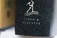 FILE - A book published by Simon & Schuster is displayed on Saturday, July 30, 2022, in Tigard, Ore. On Monday, Oct. 31, 2022, a federal judge blocked Penguin Random House's proposed purchase of Simon & Schuster. (AP Photo/Jenny Kane, File)
