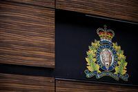 The RCMP logo is seen outside Royal Canadian Mounted Police "E" Division Headquarters, in Surrey, B.C., on Friday April 13, 2018. One of the first Indigenous women to join the RCMP in Manitoba is the lead plaintiff in a proposed class-action lawsuit that alleges systemic racism within the force. THE CANADIAN PRESS/Darryl Dyck