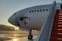 A handout picture released by the Facebook page of the Iraqi ministry of transportation, shows a damaged stationary aircraft on the tarmac of Baghdad airport, after rockets reportedly tragetted the runway, on January 28, 2022. - Six rockets were fired at the Iraqi capital's airport at dawn today, causing damage to a plane but no casualties, two security sources said. (Photo by FACEBOOK PAGE OF THE IRAQI MINISTRY OF TRANSPORTATION / AFP) / === RESTRICTED TO EDITORIAL USE - MANDATORY CREDIT "AFP PHOTO / HO / FACEBOOK PAGE OF THE IRAQI MINISTRY OF TRANSPORTATION" - NO MARKETING NO ADVERTISING CAMPAIGNS - DISTRIBUTED AS A SERVICE TO CLIENTS === (Photo by -/FACEBOOK PAGE OF THE IRAQI MINIS/AFP via Getty Images)