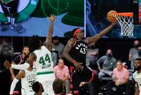 Toronto Raptors' Pascal Siakam (43) drives to the basket ahead of Boston Celtics' Robert Williams III (44) during the first half of an NBA conference semifinal playoff basketball game Saturday, Sept. 5, 2020, in Lake Buena Vista, Fla. (AP Photo/Mark J. Terrill)