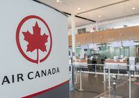 An Air Canada check-in area is shown at Montreal-Pierre Elliott Trudeau International Airport, Saturday, May 16, 2020. Air Canada says it is bolstering its summer schedule, which nonetheless remains more than 50 per cent smaller than last year as the COVID-19 pandemic continues to pound the airline industry. THE CANADIAN PRESS/Graham Hughes