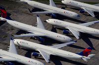 FILE PHOTO: Delta Air Lines passenger planes are seen parked due to flight reductions made to slow the spread of coronavirus disease (COVID-19), at Birmingham-Shuttlesworth International Airport in Birmingham, Alabama, U.S. March 25, 2020.  REUTERS/Elijah Nouvelage