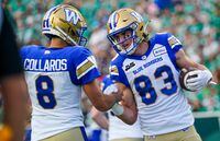 Winnipeg Blue Bombers wide receiver Dalton Schoen (83) celebrates with quarterback Zach Collaros (8) after scoring a touchdown against the Saskatchewan Roughriders during the first half of CFL football action in Regina, on Friday, June 16, 2023. THE CANADIAN PRESS/Heywood Yu
