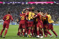 Spain players celebrate after Alvaro Morata scored the opening goal during the World Cup group E soccer match between Spain and Germany, at the Al Bayt Stadium in Al Khor , Qatar, Sunday, Nov. 27, 2022. (AP Photo/Matthias Schrader)
