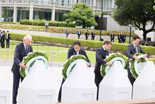 French President Emmanuel Macron, Japan’s Prime Minister Fumio Kishida, U.S. President Joe Biden, Canadian Prime Minister Justin take part in a flower wreath laying ceremony with other G7 leaders at the Cenotaph for Atomic Bomb Victims in the Peace Memorial Park as a part of G7 leaders' summit in Hiroshima, western Japan May 19, 2023, in this handout photo released by Ministry of Foreign Affairs of Japan. Ministry of Foreign Affairs of Japan/HANDOUT via REUTERS