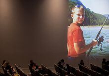 A photo of Carson Crimeni is projected on a wall as people listen during a celebration of life for the late 14-year-old in Langley, B.C., on Thursday August 29, 2019. A man has pleaded guilty to manslaughter in the high-profile death of the 14-year-old boy in 2019.THE CANADIAN PRESS/Darryl Dyck