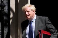 British Prime Minister Boris Johnson leaves 10 Downing Street, in London, to attend the weekly Prime Minister's Questions at the Houses of Parliament, Wednesday, June 22, 2022. (AP Photo/Matt Dunham)