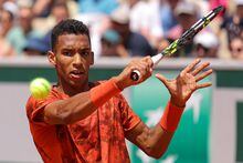 Canada's Felix Auger-Aliassime plays a forehand return to Italy's Fabio Fognini during their men's singles match on day two of the Roland-Garros Open tennis tournament at the Court Simonne-Mathieu in Paris on May 29, 2023. (Photo by Thomas SAMSON / AFP) (Photo by THOMAS SAMSON/AFP via Getty Images)