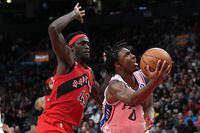 Philadelphia 76ers' Tyrese Maxey, right, shoots as Toronto Raptors' Pascal Siakam defends during second half NBA basketball action in Toronto on Friday, October 28, 2022. THE CANADIAN PRESS/Chris Young