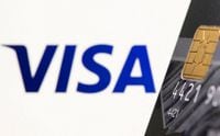 FILE PHOTO: Credit card is seen in front of displayed Visa logo in this illustration taken, July 15, 2021. REUTERS/Dado Ruvic/Illustration
