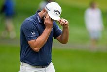 Jon Rahm, of Spain, wipes his face on the seventh hole during the second round of the PGA Championship golf tournament at Oak Hill Country Club on Friday, May 19, 2023, in Pittsford, N.Y. (AP Photo/Abbie Parr)