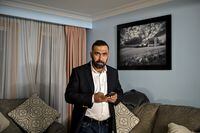 Saeeq Shajjan, an Afghan refugee who made it to Canada and whose law firm worked for the Canadian embassy in Kabul for almost 9 years. poses for a photograph at home in Toronto, on Tuesday, December 14. 2021. (Christopher Katsarov/The Globe and Mail)